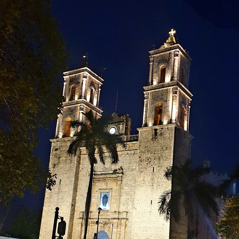 a large clock tower in front of a building