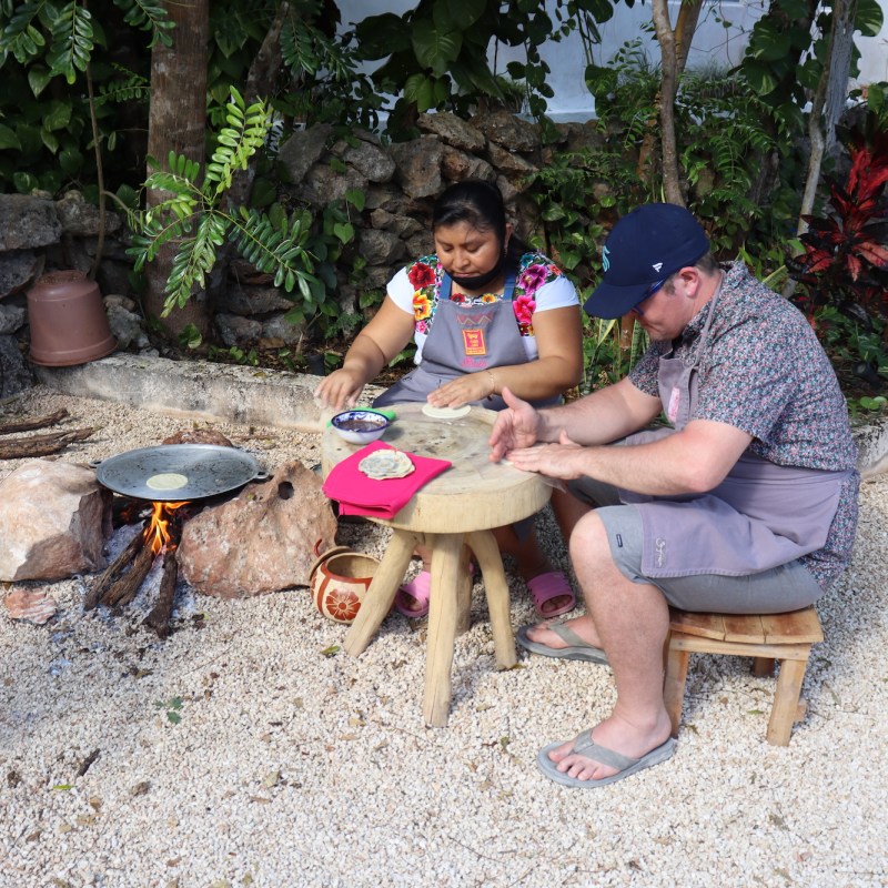 a group of young men sitting on a bench
