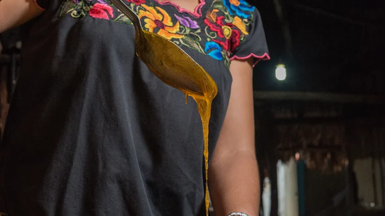 a little girl sitting in a bowl