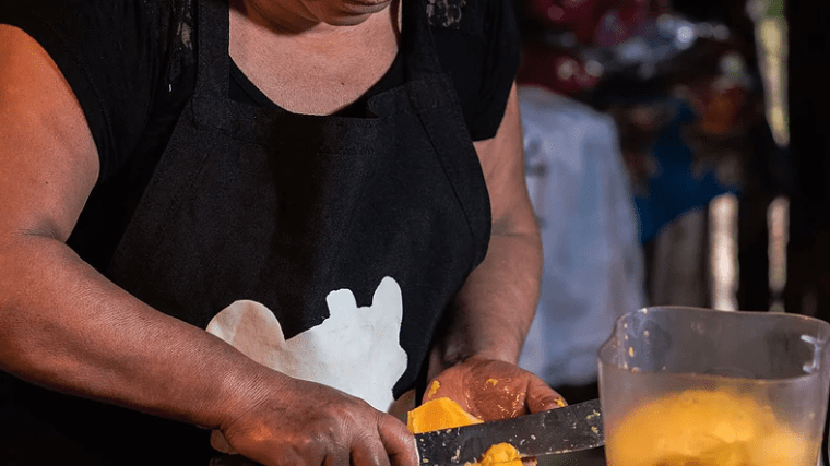 a person sitting at a table with food