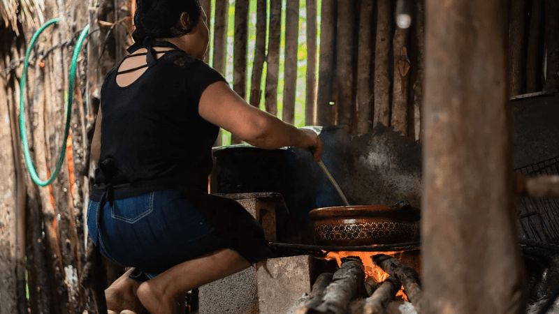 a person standing on a grill