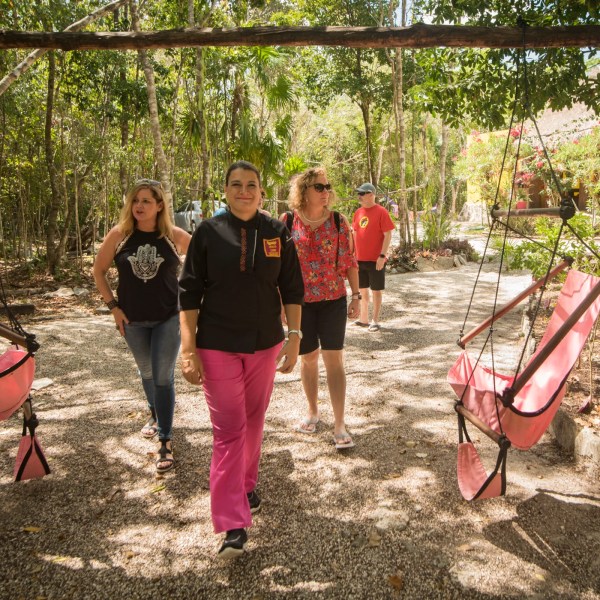 Chef walking with guests in the jungle