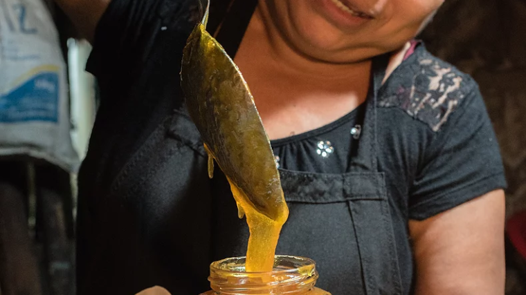 a person sitting at a table with food
