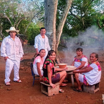 Tommy Wildcat et al. standing in a park