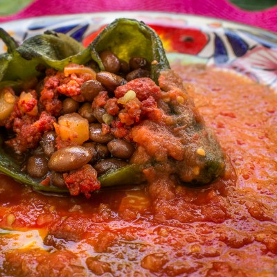 a pizza sitting on top of a plate of food
