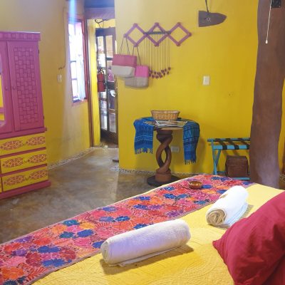 a bedroom with a bed in a room