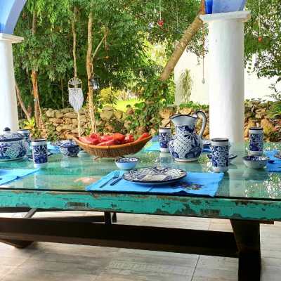 a glass with a blue picnic table