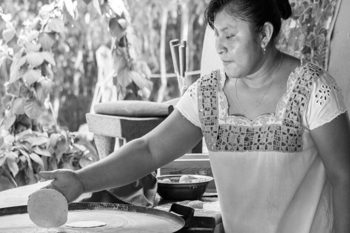 a person standing in front of a table