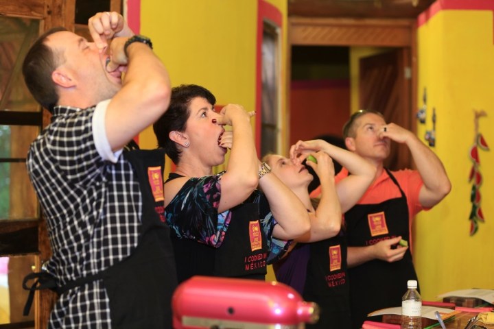 a group of people looking at a cell phone