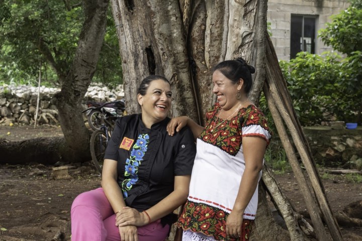 a woman sitting on a bench