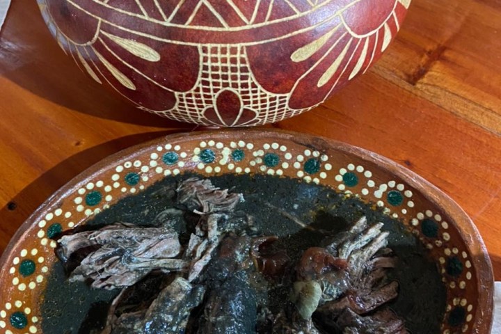 a cake sitting on top of a wooden table