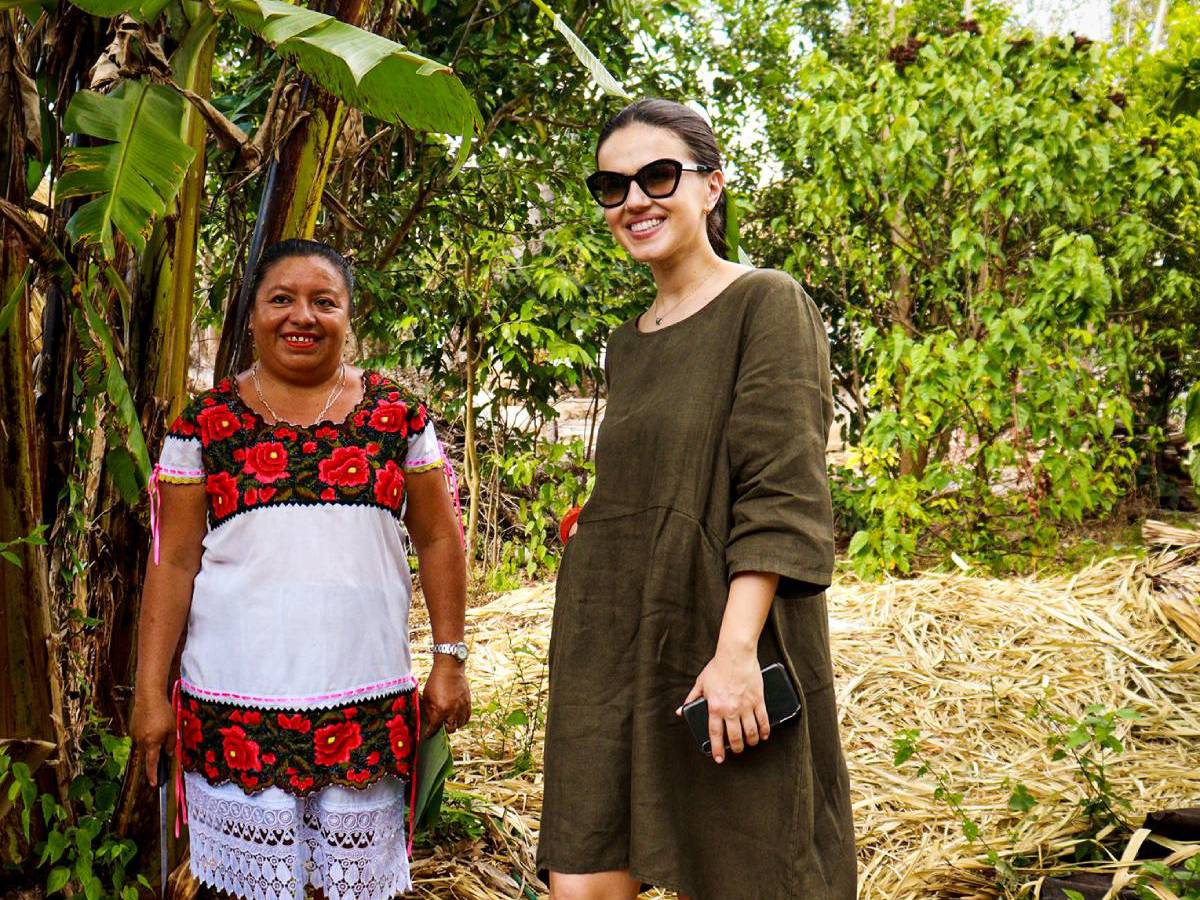a man standing in front of a tree posing for the camera